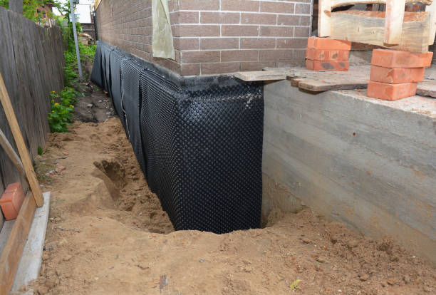 Happy homeowners after waterproofing job in Watertown